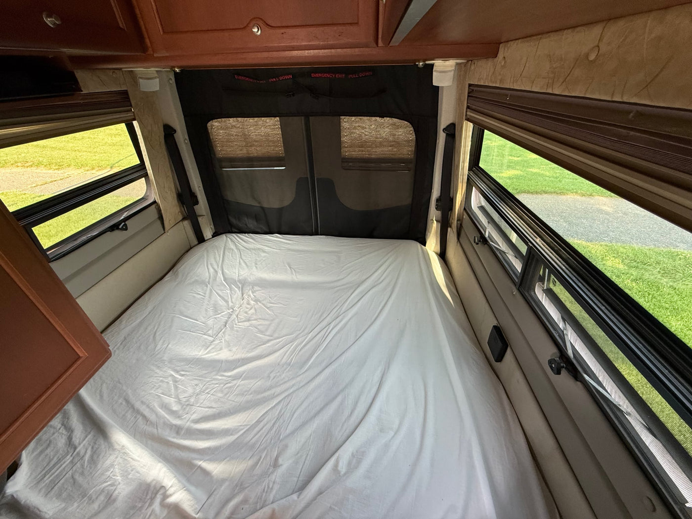  wood cabinetry. Perfect for your next rv rental adventure.|Clean RV rental kitchen: two-burner stove — photo 19