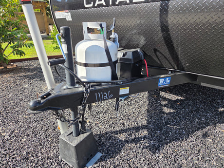 RV rental front hitch with propane tank, battery, and serial 11126, ready for travel.