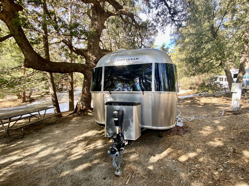  and cozy blue dinette seating.|Compact RV rental kitchen interior: sink — photo 14