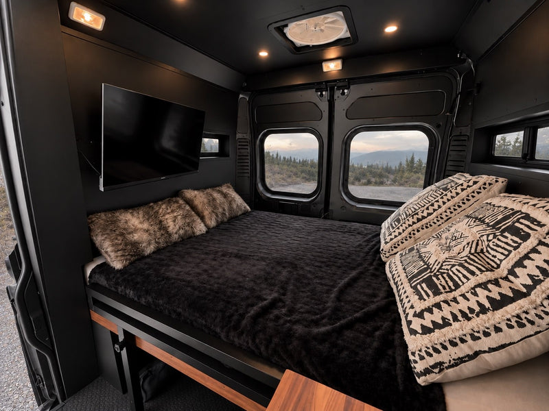  and scenic mountain views.|Cozy RV rental interior featuring a comfortable bed — photo 3