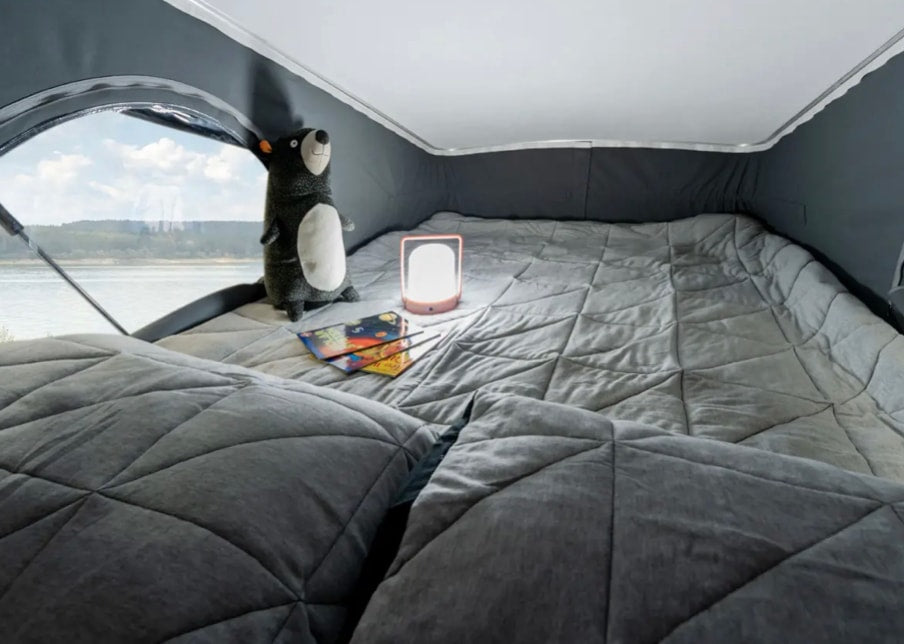  complete with a sink.|Inside this RV rental: a compact dining area with Clue game