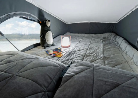  complete with a sink.|Inside this RV rental: a compact dining area with Clue game