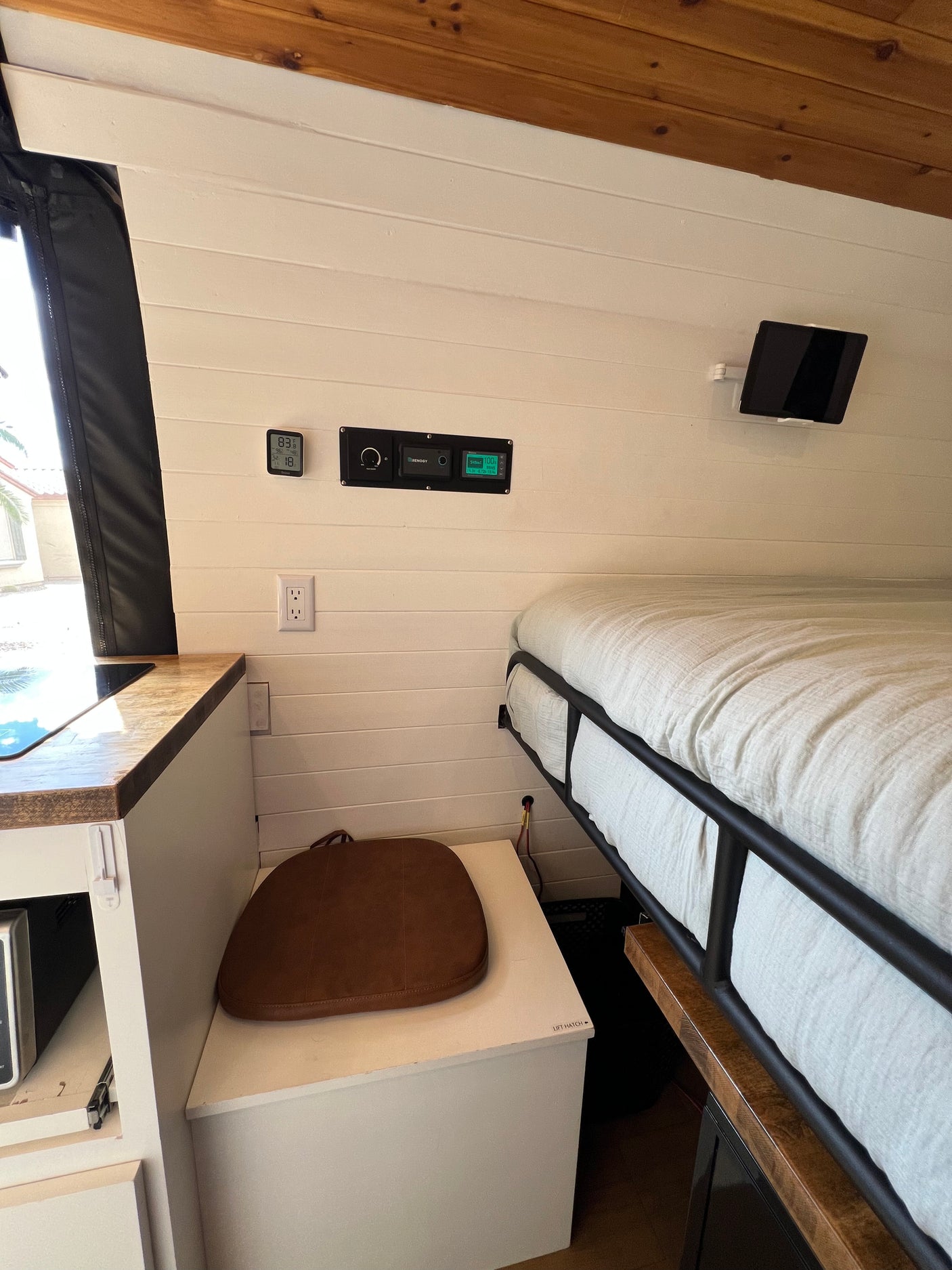 This RV rental offers a cozy interior with a bed, kitchenette, and smart controls. Enjoy your mobile adventures!