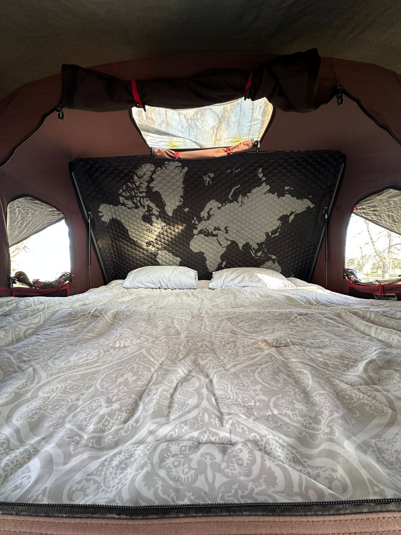  featuring a unique world map headboard and bright window views.|Fully equipped campsite with a gray SUV — photo 3