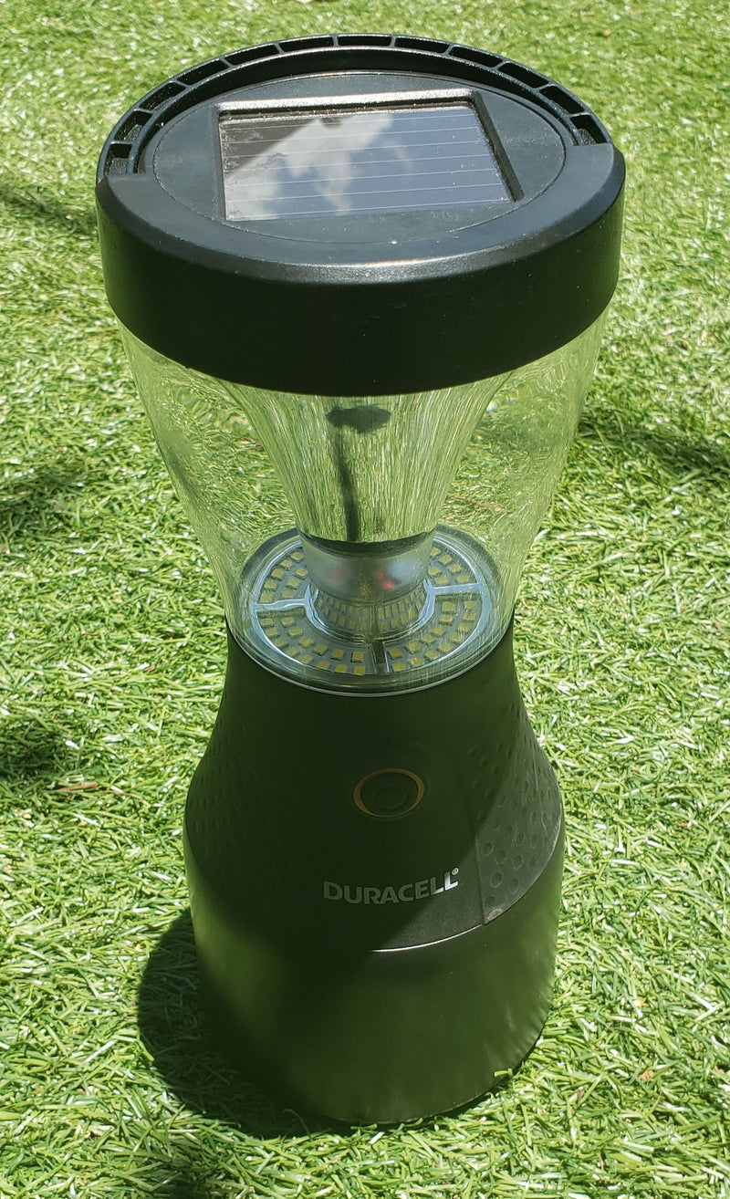 Duracell solar LED lantern, charging on artificial grass, a perfect portable light for your rv rental adventures. — photo 11