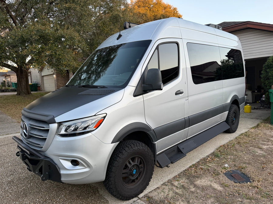 Customized silver Mercedes Sprinter camper van