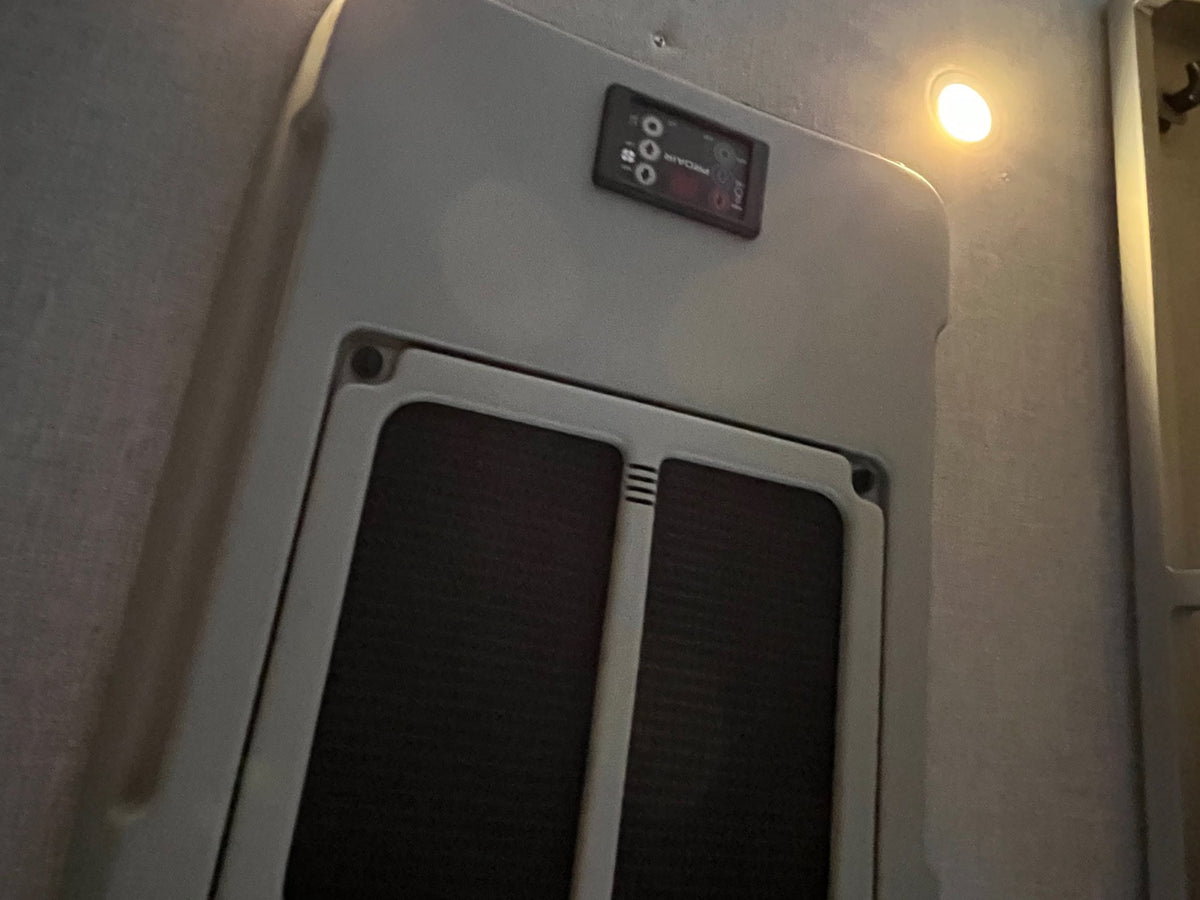  and lighting for travel comfort.|Inside a modern rv rental van: black swivel seats — photo 19