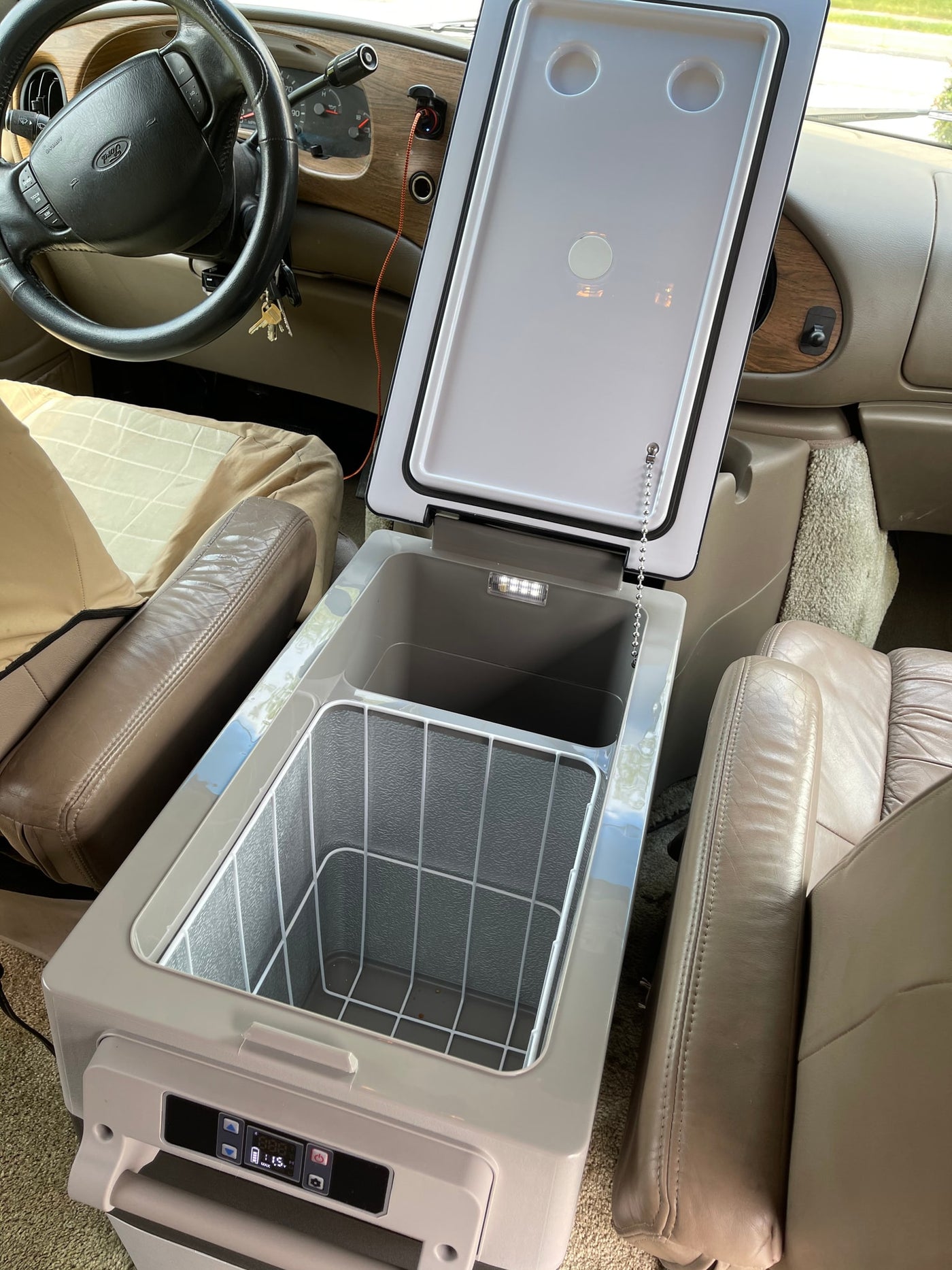  ready for convenient travel.|**RV rental** power setup: 750-watt inverter & battery box on the floor — photo 16