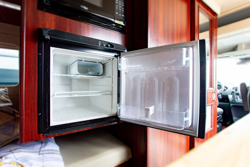  equipped with a roof AC and side step.|Spacious front cab of an RV rental van — photo 10
