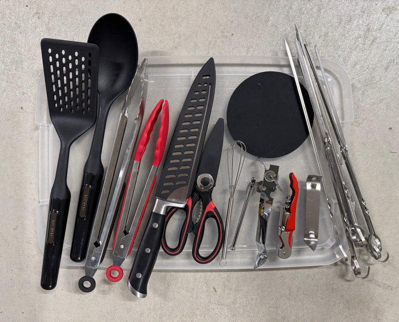 This RV rental essential kit includes diverse kitchen and grilling utensils: a spatula, spoon, tongs, knife, shears, whisk, openers, and skewers. — photo 20