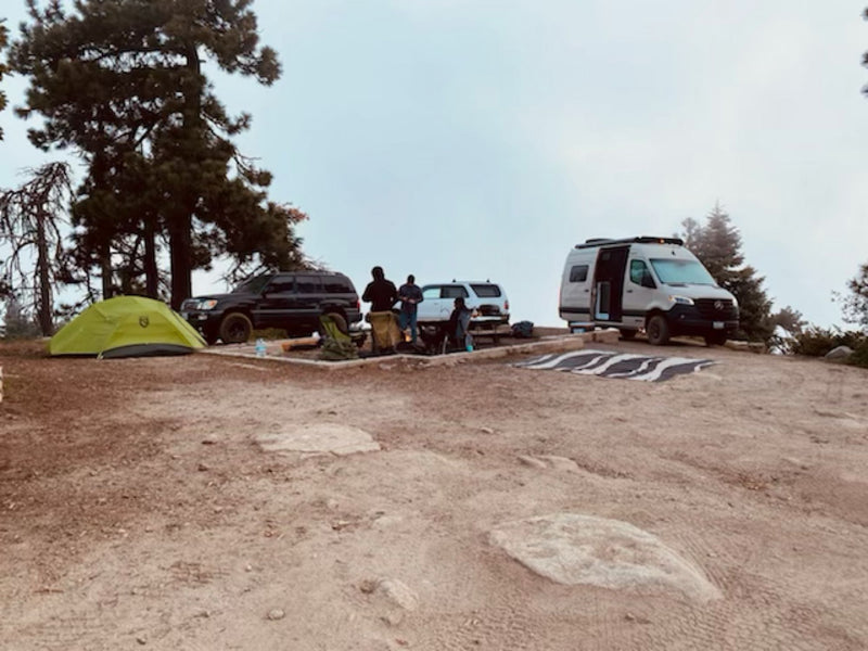  with an outdoor area set up for relaxing and enjoying the outdoors.|Tan Winnebago RV rental parked at Four Lanterns Winery — photo 12