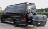 Matte black custom Sprinter van, an ideal rv rental, towing a cargo carrier for your next adventure.