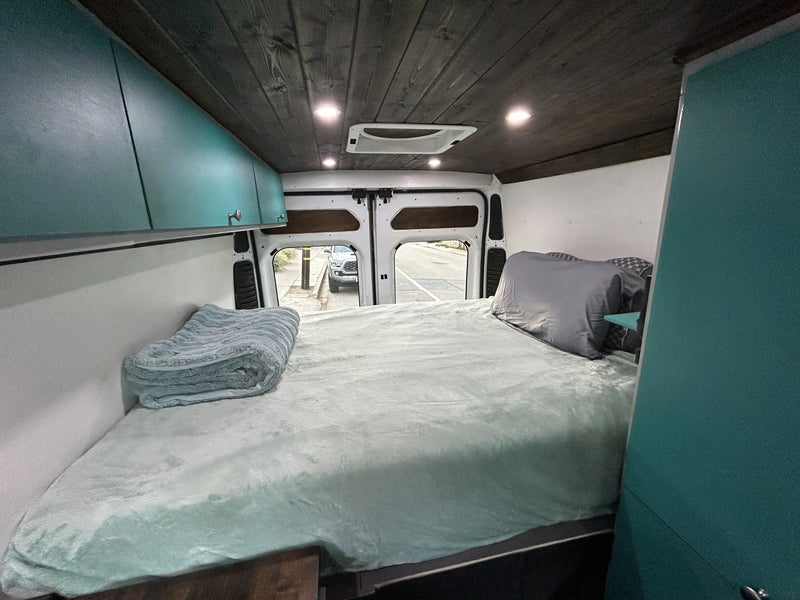  and rustic wood finishes for van life.|Modern rv rental camper van interior: wood ceiling — photo 3