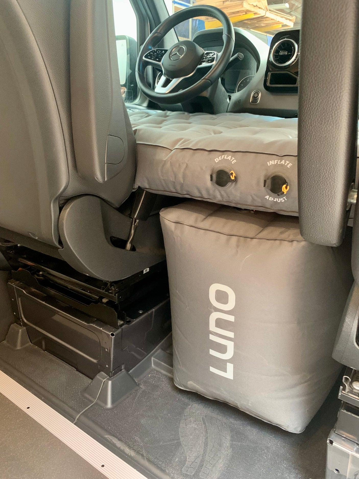 RV rental interior with Luno air mattress & cushion transforming the front cabin for sleeping.