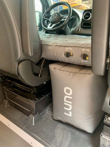 RV rental interior with Luno air mattress & cushion transforming the front cabin for sleeping.