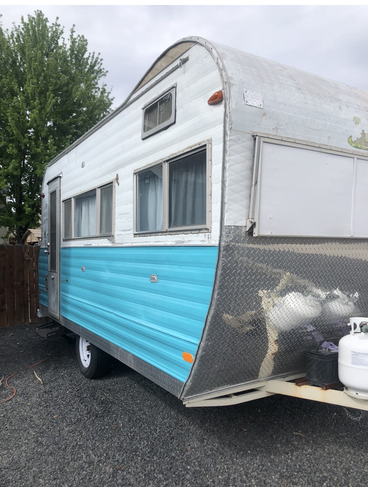 Classic turquoise & white RV rental. This vintage camper with its curved roof and diamond plate front is ready for adventure!