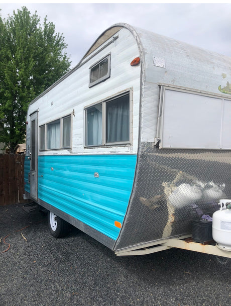 Classic turquoise & white RV rental. This vintage camper with its curved roof and diamond plate front is ready for adventure!
