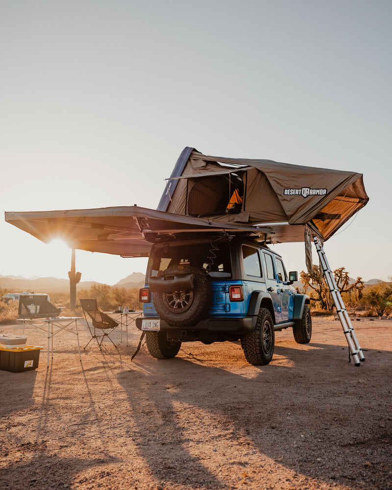 Desert Armor rooftop tent setup on a blue Jeep, perfect for overlanding adventure. A unique RV rental experience in the desert. — photo 17