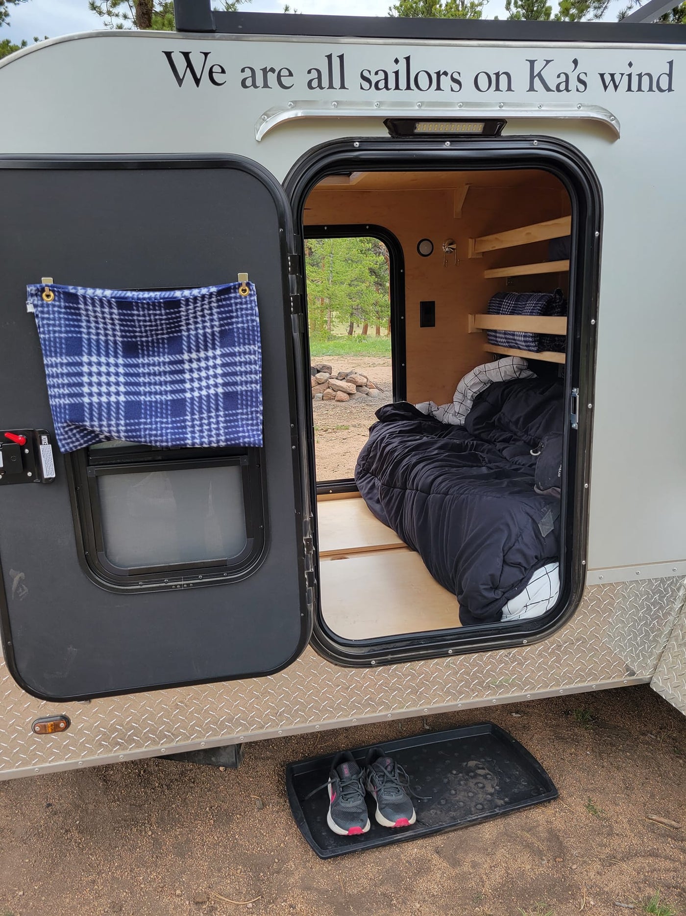 nestled among pine trees under a clear sky.|Inside a spacious RV rental annex — photo 11