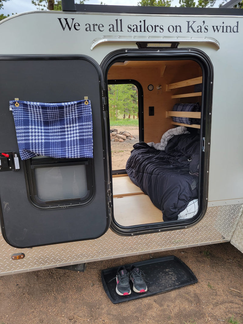  nestled among pine trees under a clear sky.|Inside a spacious RV rental annex — photo 11