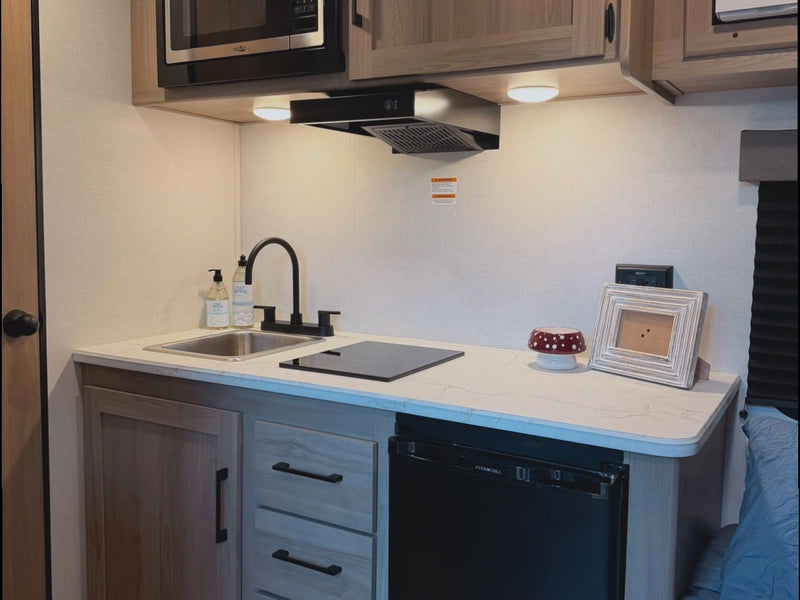  it has an awning & door.|Rear of a white Coleman RV rental — photo 4
