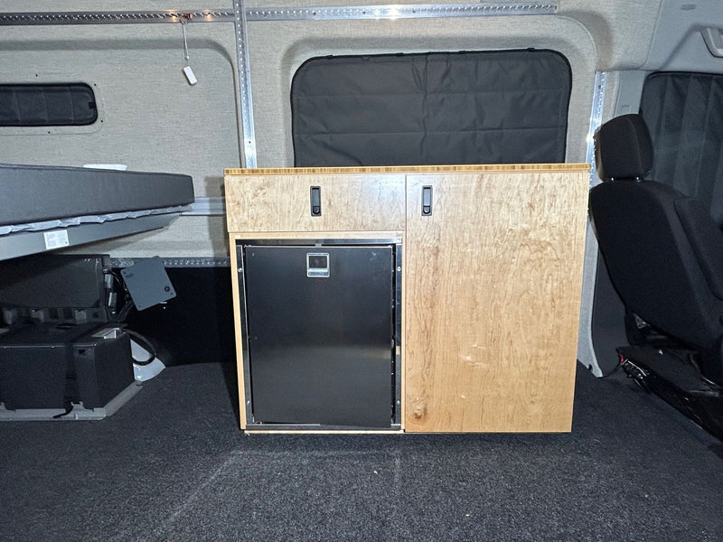  and insulated doors.|RV rental power setup: Ecoflow portable power station with battery modules provides off-grid energy for your camper van.|An RV rental interior featuring a raised bed platform — photo 5