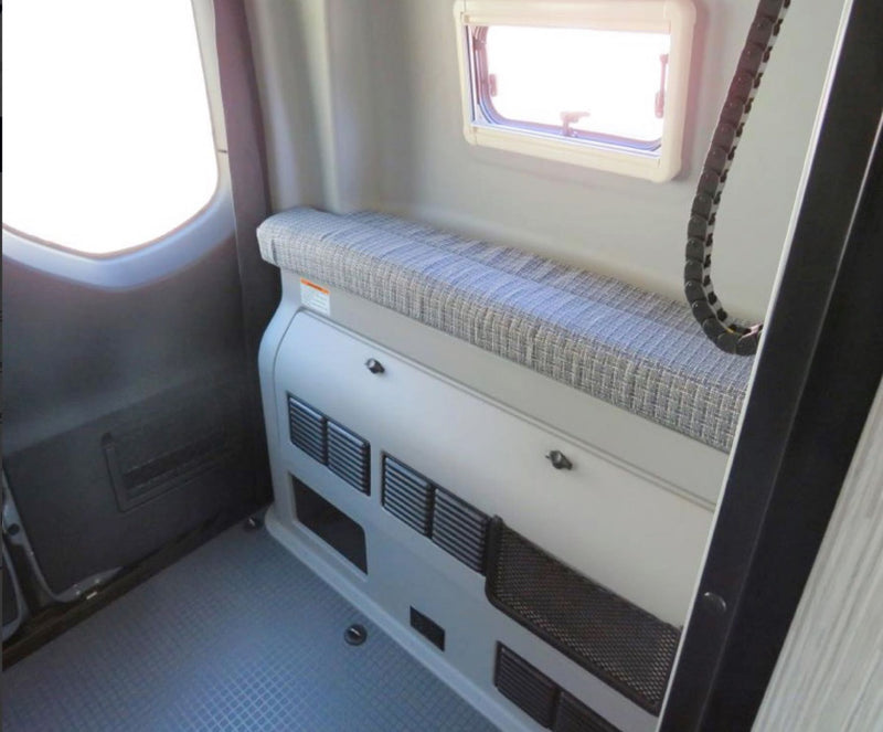  and an overhead sleeping bunk.|Explore this compact RV rental kitchen featuring a stainless steel sink — photo 16
