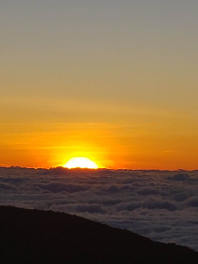  ideal for an RV rental getaway. Lush tropical landscape awaits!|Vibrant orange sunset illuminating clouds from above