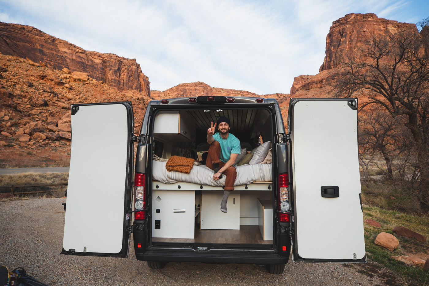  custom cabinet for off-grid adventures.|RV rental interior: cozy bed — photo 12