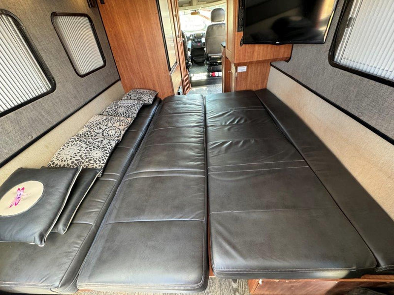  and door bins. Ample storage for all your travel provisions.|Inside an RV rental: a Dometic air conditioner on the ceiling — photo 16