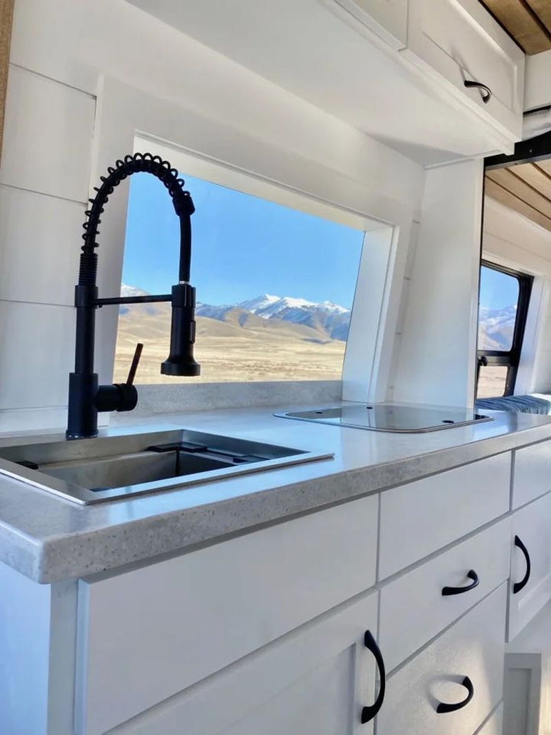  and scenic mountain views.|This custom camper van interior — photo 3