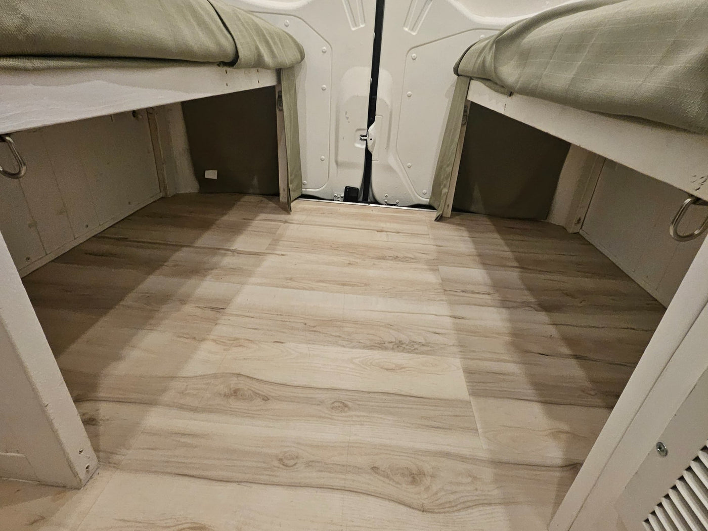  two light-tan benches with seatbelts face each other — photo 13