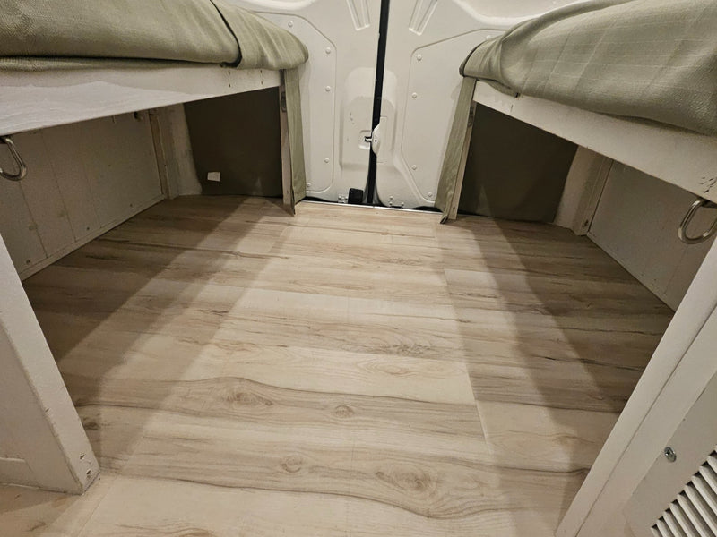  two light-tan benches with seatbelts face each other — photo 13