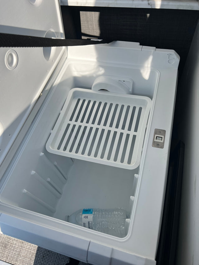  parked under a blue sky. Ready for your next outdoor camping trip.|Inside an RV rental's portable fridge