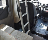 RV rental interior: Aluminum ladder for bunk access, front cab, and rear sleeping cushions shown.