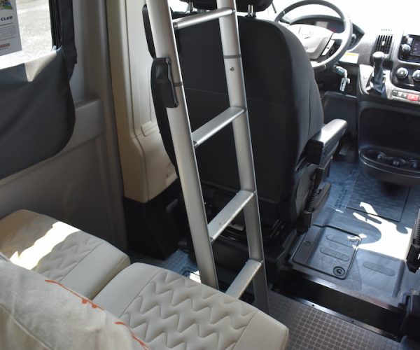  and a modern digital control panel.|RV rental van's cockpit showing steering wheel