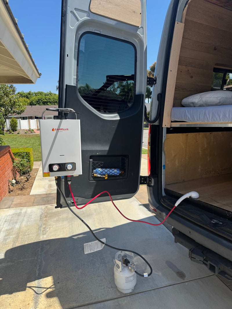 RV rental camper van with a portable outdoor shower: Camplux water heater, propane tank, and shower head at the rear. — photo 19