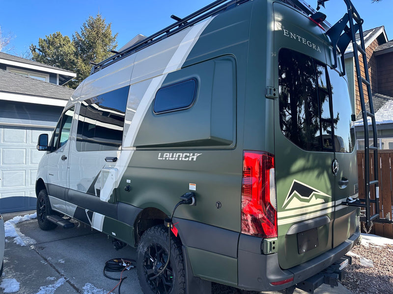  compact RV rental refrigerator: open door with shelves — photo 1
