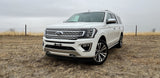 White Ford Expedition SUV, ideal for remote adventures. While not an RV rental, it offers ample space for trips.