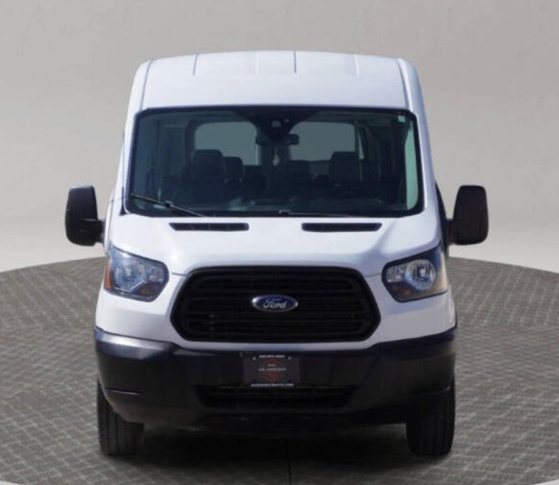  a practical choice for your next RV rental.|Front view of a white Ford Transit van on a turntable — photo 2