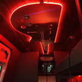 Explore this RV rental's unique custom interior, showcasing a bold red LED guitar design on the ceiling and ambient lighting.