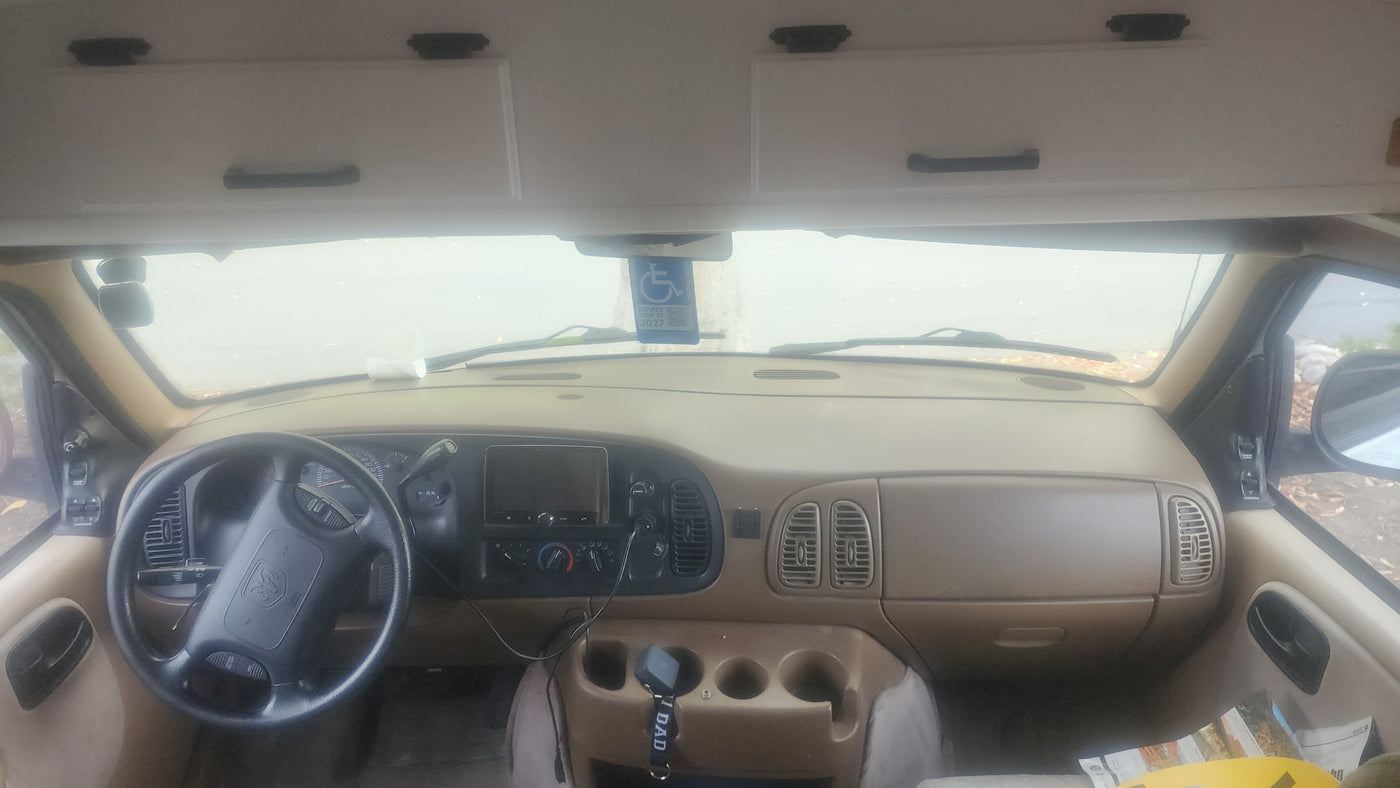  and two dogs outdoors.|Interior of an rv rental — photo 9