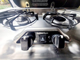 This two-burner Suburban gas cooktop in an rv rental provides convenient kitchen access on the road.