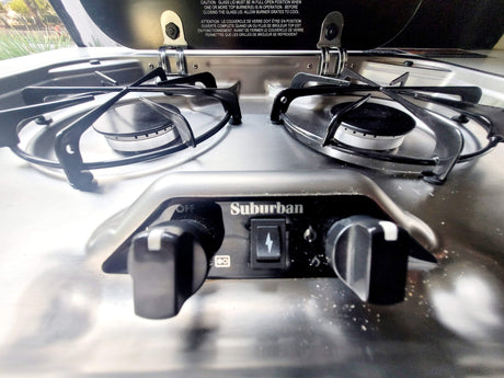 This two-burner Suburban gas cooktop in an rv rental provides convenient kitchen access on the road.