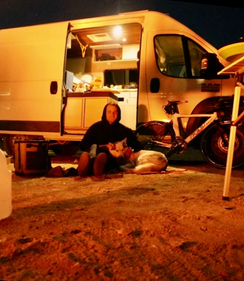  and a two-burner gas stove with lit flames.|RV rental interior: Wooden ceiling — photo 9