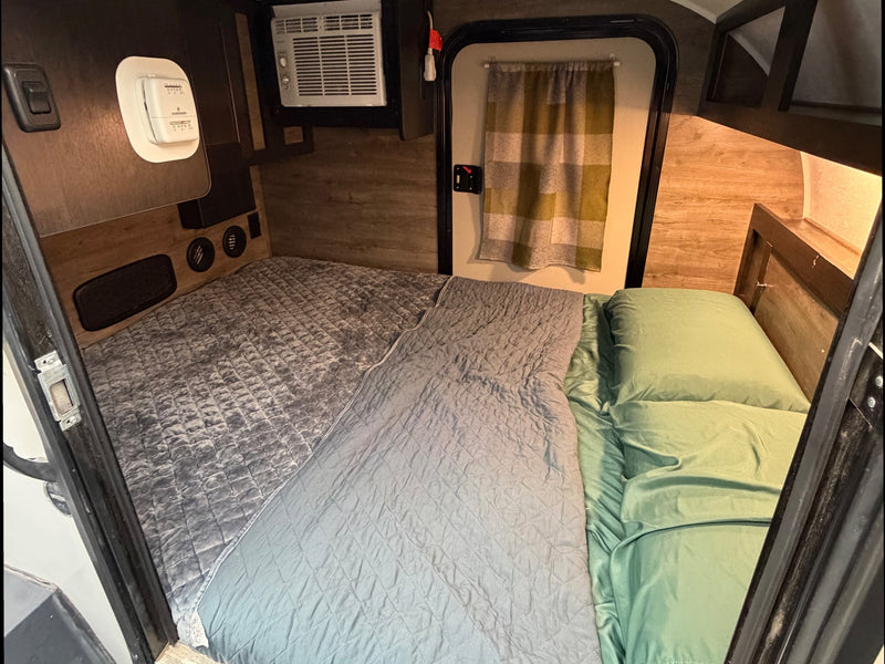  and propane.|Grey Bushwhacker teardrop RV rental parked — photo 4