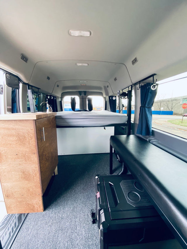  ready for adventure.|RV rental: Modern camper van interior featuring an elevated bed