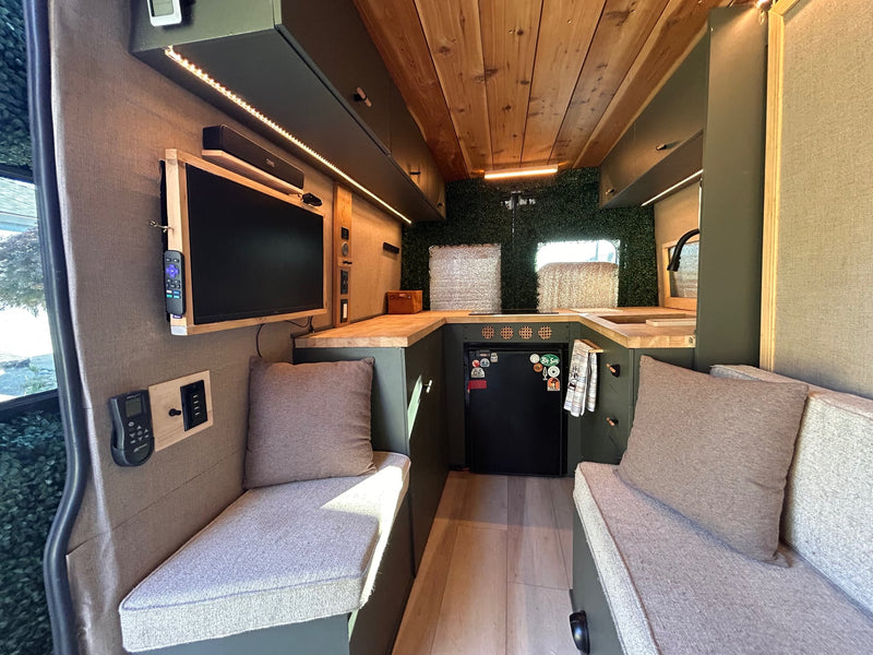 Inviting RV rental interior with green cabinetry — photo 1