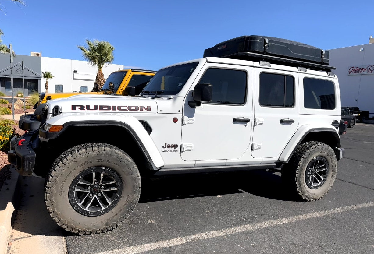  a rugged option for your next RV rental.|White Jeep Rubicon with a roof tent — photo 3