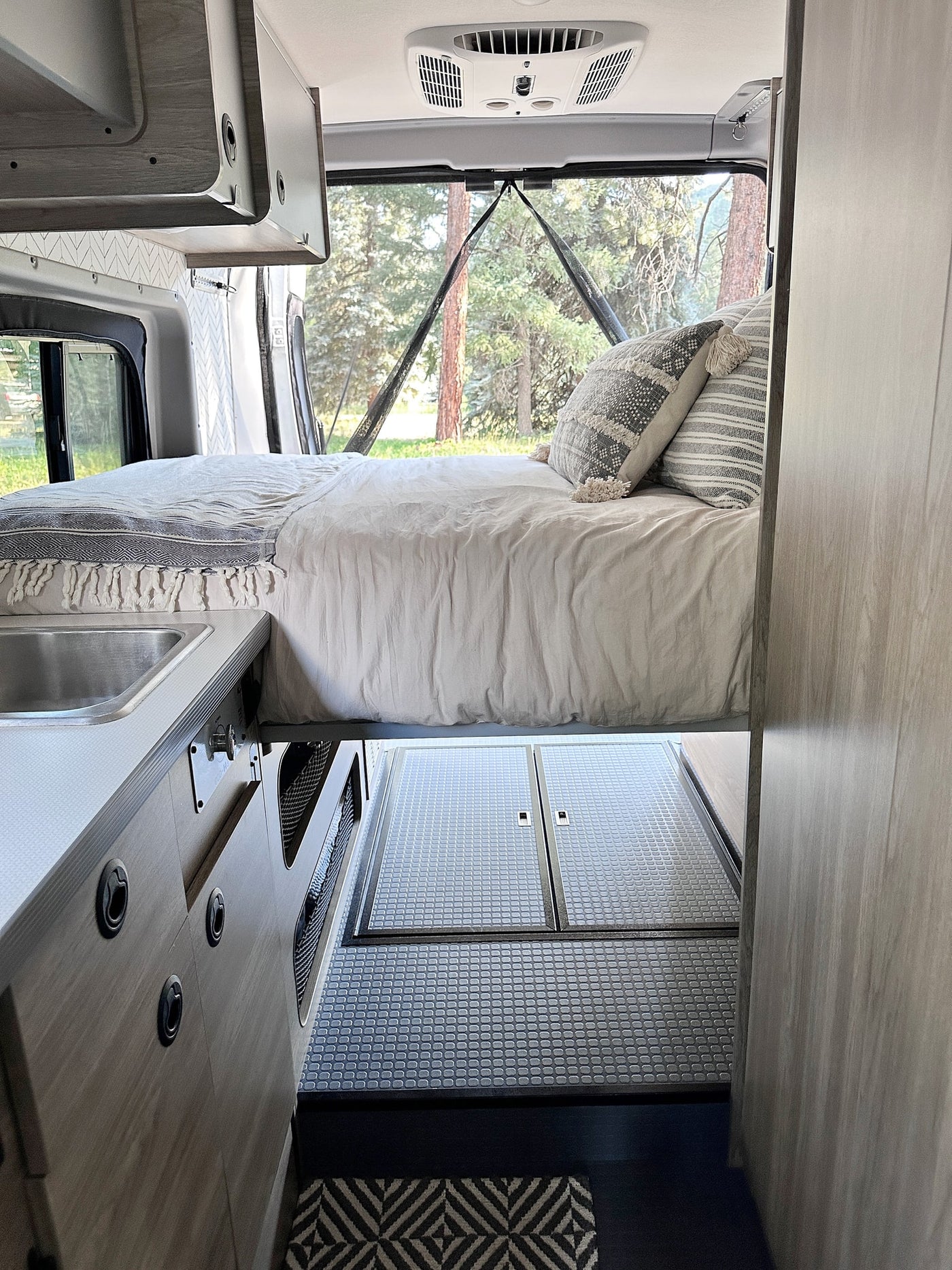  and passenger seat. Compact and functional space.|Spacious RV rental interior with modern kitchen — photo 19